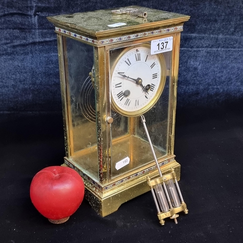 137 - Star Lot : A gorgeous antique French made brass carriage clock featuring an enamel dial with Roman n... 