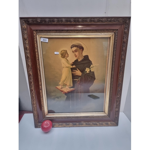 333 - A large vintage print of St Anthony housed in a wooden frame.