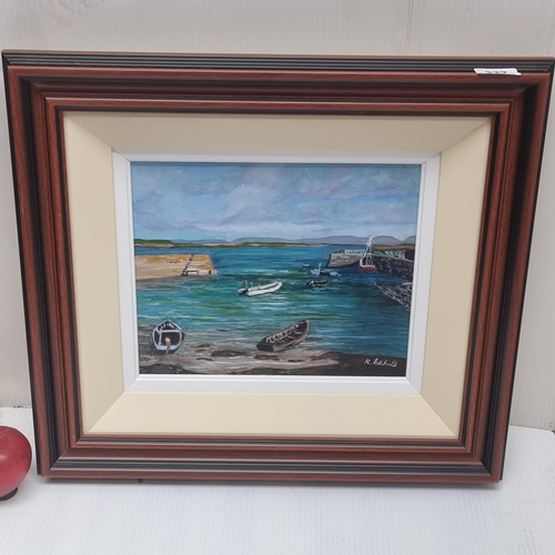 337 - A wonderful original oil on canvas painting signed R. Cahill featuring a small Irish harbour with bo... 