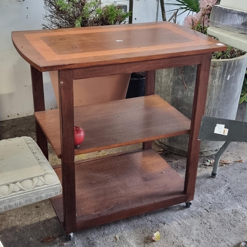 969 - A handsome Mid Century Modern hostess trolley. Featuring a two tier teak wood construction with a ni... 