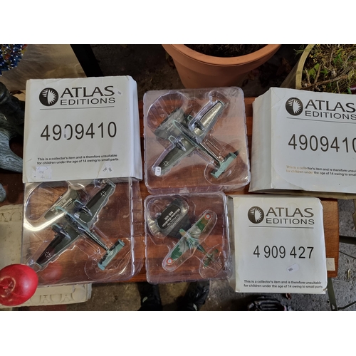 971 - Three Atlas Editions model planes. These collectables include a Morane Saulnier MS406 and two Messer... 