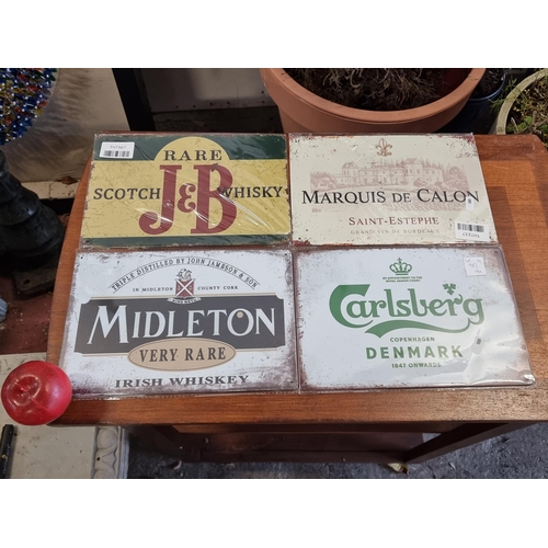 973 - Four advertising metal signs of a breweriana theme. Including brands such as Carlsberg, Midleton Whi... 