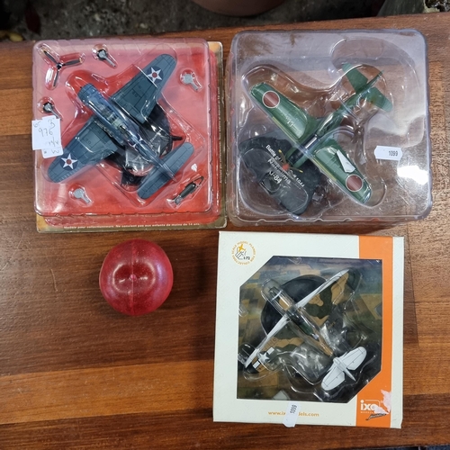 976 - Three brand new collectable model planes. Including an Ixomodels Airacobra fighter plane and an Atla... 