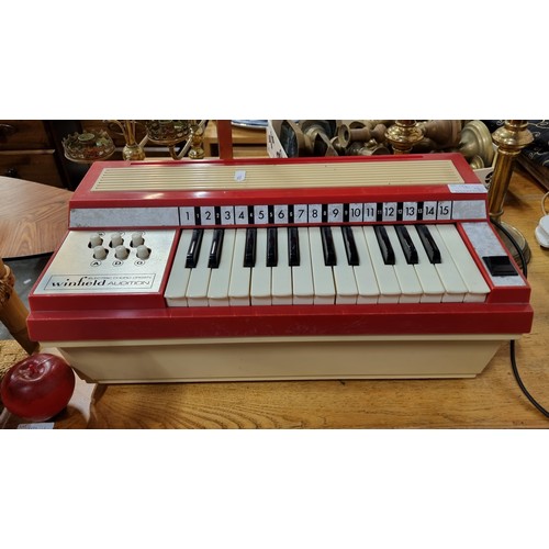 930 - A vintage electric chord organ made by Winfield Audition.