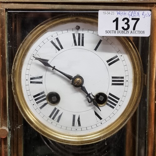 137 - Star Lot : A gorgeous antique French made brass carriage clock featuring an enamel dial with Roman n... 