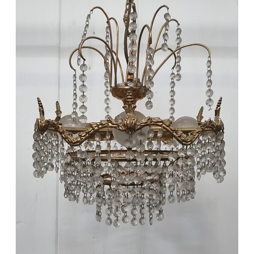 991 - A beautiful chandelier with a brass toned frame featuring foliate detail and beaded droplets. A matc... 