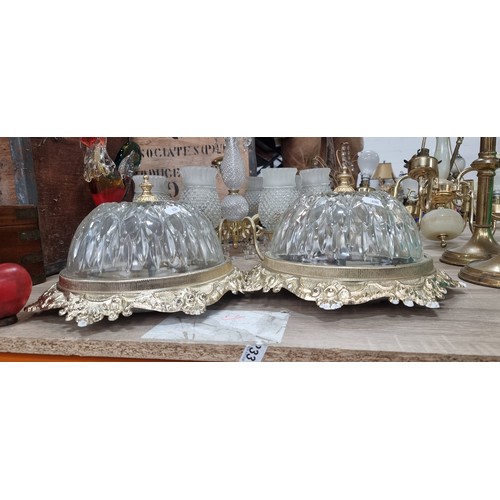 992 - Two fabulous dome ceiling lights with a brass toned mount boasting delicate foliate motifs and holdi... 