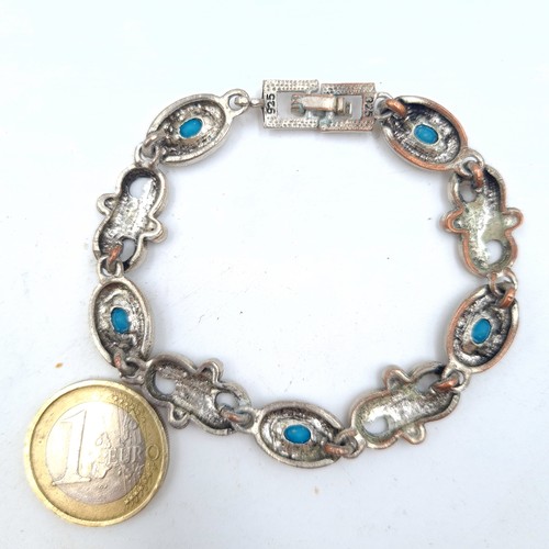 43 - A very pretty sterling silver bracelet, featuring pretty turquoise and swirl spaces. Marked 925. Dia... 