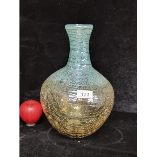 133 - A wonderful large hand blown vase with blue speckling to stem crazing to base, decorated with molten... 