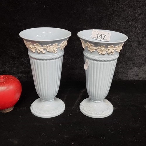 147 - A beautiful pair of vintage Neoclassical style vases from Wedgwood of Eutruria. In a light blue glos... 