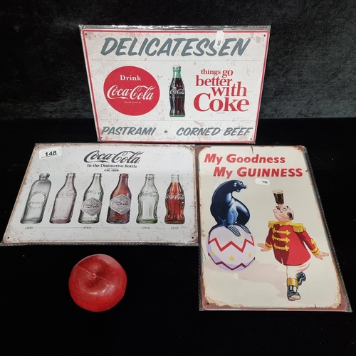 148 - Three metal advertising signs with two for Coca Cola and one for Guinness. All illustrated with colo... 
