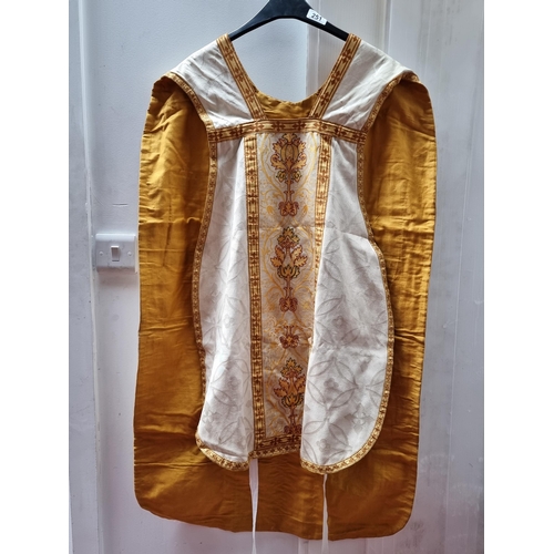 251 - A priests ecclesiastic chasubla vestment in embroidered white and gold.