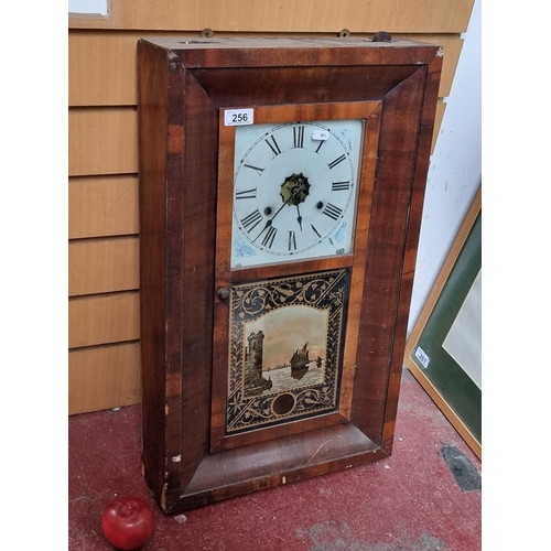 256 - A gorgeous antique thirty hour wall clock with parquetry mahogany frame, roman numeral face and hand... 