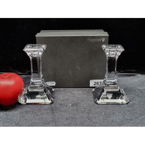 267 - A pair of brand new Orrefors cut crystal candle stick holders in original box with all labels and pa... 