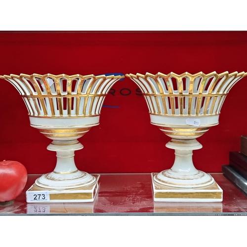 273 - An ornate pair of French Porcelain fruit bowls with pierced basket tops stood on pedestal bases. Boa... 