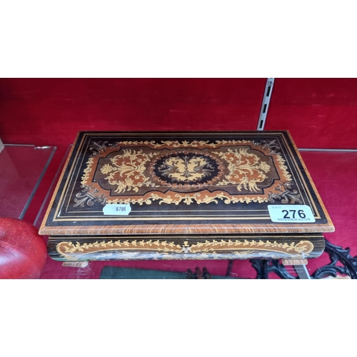 276 - An pretty wooden Sorrento jewellery box with an ornate foliate design throughout and mirror to lid. ... 