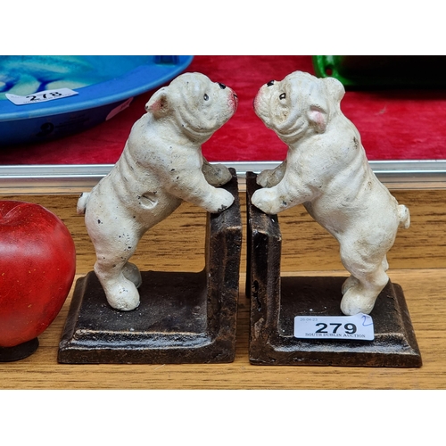 279 - A pair of heavy cast metal book ends in the form of charming British Bulldogs.