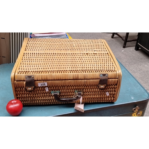 318 - A wonderful rare vintage wicker suitcase with a Bakelite handle, hinged lid, leather straps and bras... 