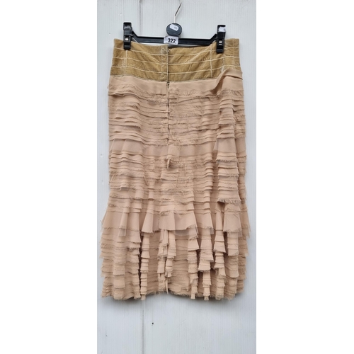 322 - An elegant midi ruffle skirt by Flynow UK size 14. With buttons and zipper to back and in a beige sh... 