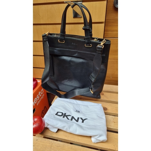 336 - A stylish DKNY black genuine leather with ample storage including zip up compartments to interior an... 