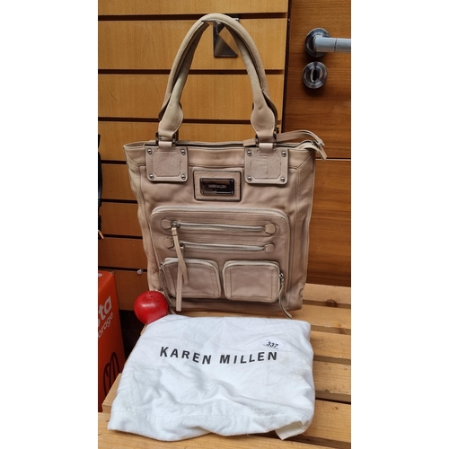 337 - A Karen Millen genuine leather bag with plenty of storage to front as well as interior in a light be... 