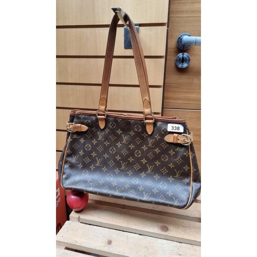 338 - Star Lot : A beautiful genuine Louis Vuitton ladies handbag featuring the iconic monogram in brown a... 