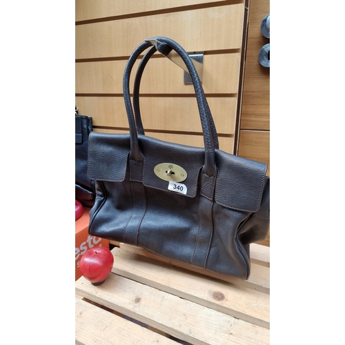 340 - An elegant genuine Mulbery brown leather handbag with zip up compartment to interior and brass fitti... 