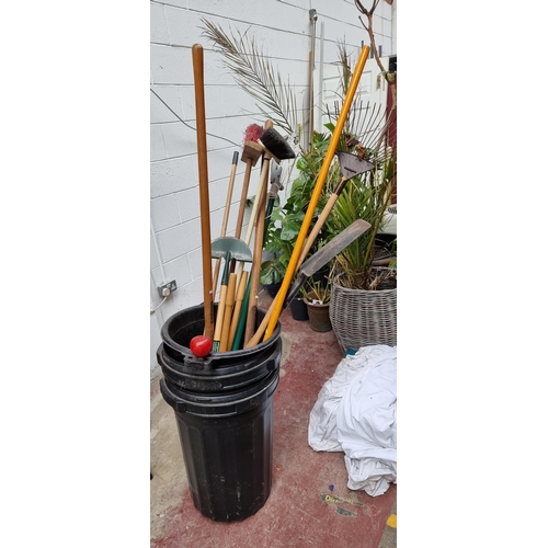 349 - Three large good quality buckets containing 11 garden tools including yard brushes, a pitch fork, sh... 