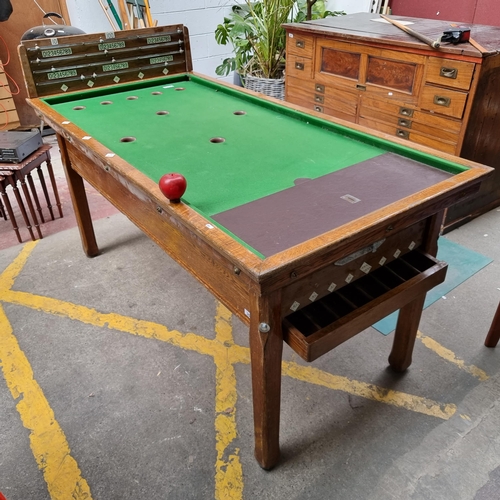 350 - Star lot : A fabulous vintage coin operated billiards table with a green baize top with 9 holes and ... 