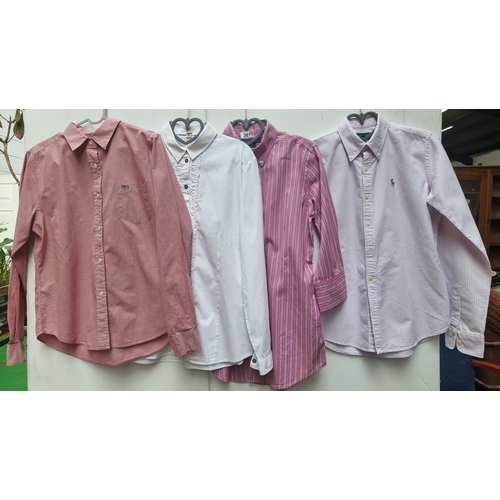 361 - A selection of four stylish ladies' designer shirts including a white Burberry example with ruffled ... 