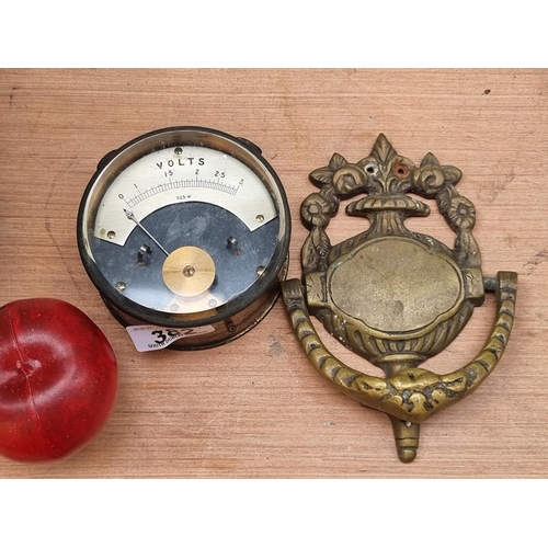 382 - Two heavy vintage items. Including a vintage voltmeter with a thick bevelled glass face. Along with ... 