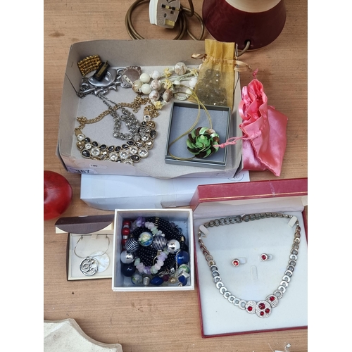 387 - A selection of approximately twelve jewellery items. Including a vintage Casual Corner branded half ... 