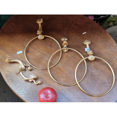 394 - A set of five wonderful gold toned bathroom fittings. Each designed in a gold tone with a figural ko... 