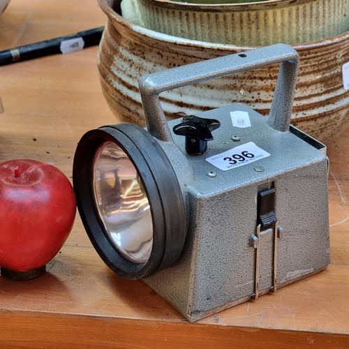 396 - A very useful vintage railway hand lamp. Designed in a compact silver toned case with a wonderful al... 