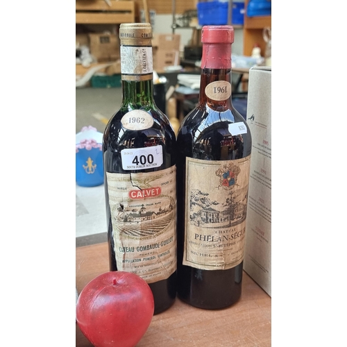 400 - Two sealed vintage bottles of red wine dating to the 1960s. Including a 1961 Chateau Phélan-Segur an... 