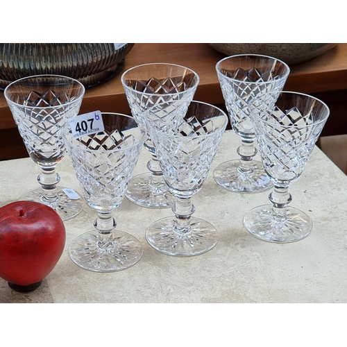 407 - Six stemmed Waterford Crystal glasses in the Adare pattern with acid marks to base. In VGC