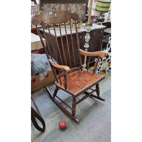 409 - An elegant antique Edwardian rocking chair with spindle back, turned wood legs and stretcher and set... 