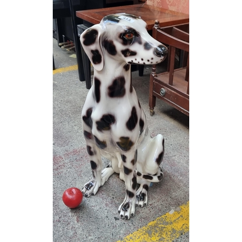 413 - A wonderful large vintage life sized figure of a charming Dalmatian dog in a seated pose, waiting fo... 