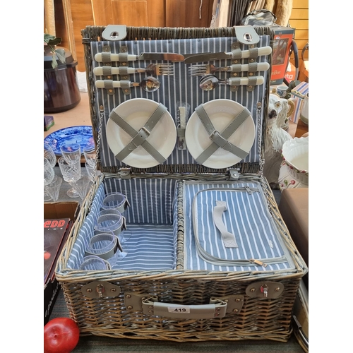 419 - A fabulous large wicker picnic basket with grey leather fittings, lined with a blue and white stripe... 