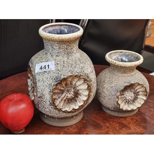 441 - A pair of earthenware vases by Dumler and Breiden both featuring concave flower design, speckle fini... 