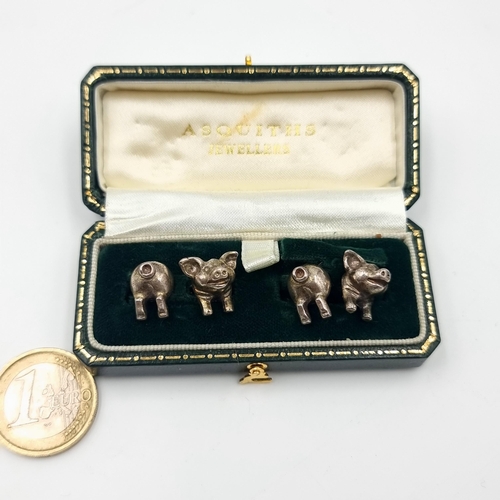 6 - A beautiful and intricate pair of sterling silver cuff links, featuring quirky piglets. Presented in... 