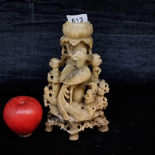 613 - A lovely hand carved soapstone candlestick with a large phoenix to centre perched on asian flora.