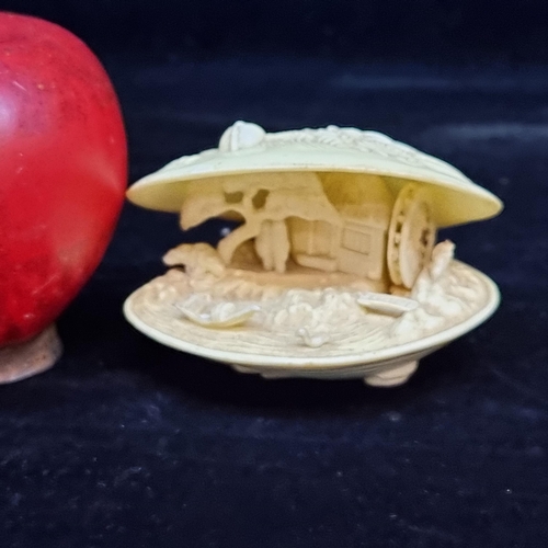 648 - A charming Japanese clam shell diorama. A mid twentieth century piece with detailed interior featuri... 