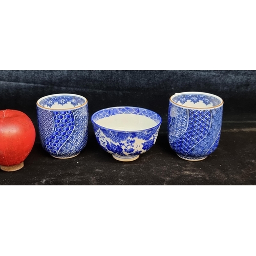 650 - A trio of Chinese porcelain vessels. Including a pair of Yunomi cups with a Wagara blue glaze transf... 