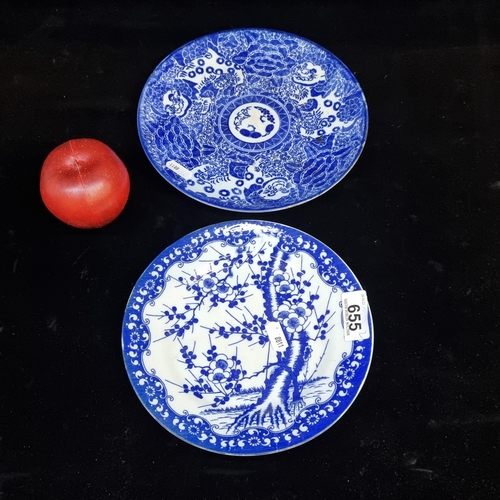 655 - Two Chinese porcelain plates. Including a heavy blue glaze example with three foo dogs and large chr... 