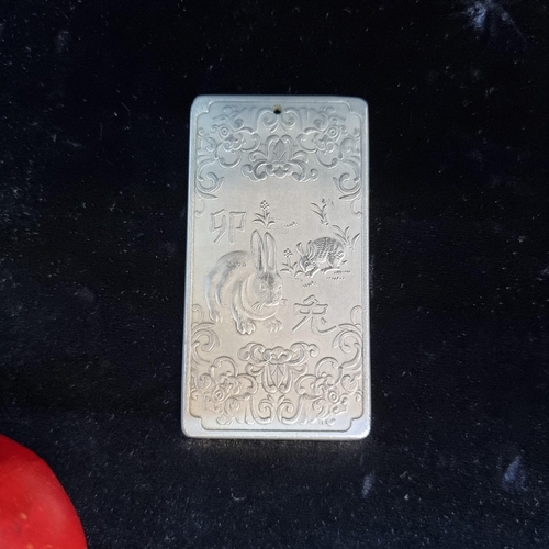 663 - A very heavy Chinese silver Taoist tablet. Featuring a relief image of a Rabbit on verso celebrating... 