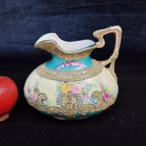 665 - A beautiful antique Noritake or Morimura porcelain jug. Featuring a floral backdrop with a delicatel... 