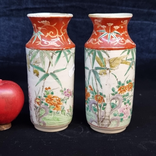 673 - A pair of late 19th century Chinese porcelain vases. Featuring hand-painted foliate motifs with larg... 