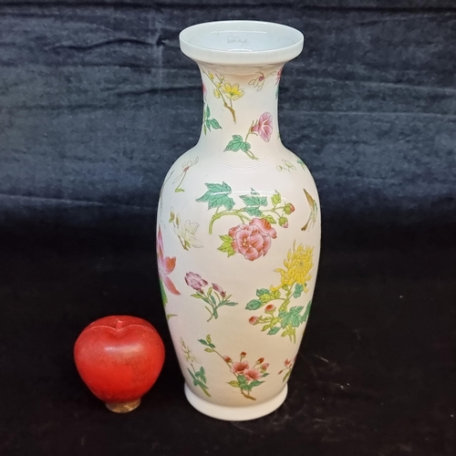 675 - A pretty vintage Chinese porcelain vase. Sporting a delicate pattern of flowers and insects. Includi... 