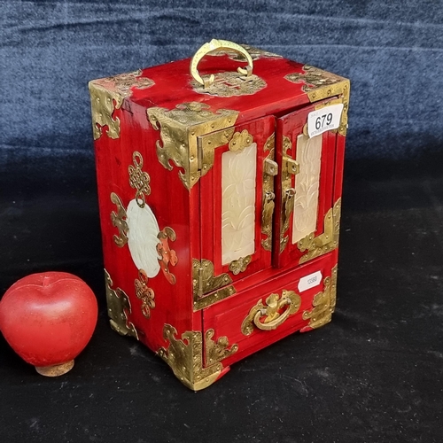 679 - A beautiful Chinese lacquered jewellery box. Finished in a rich red stain with etched brass hardware... 